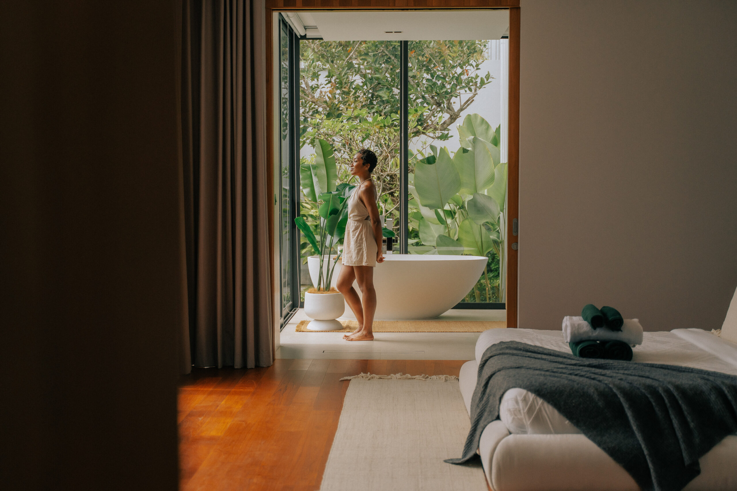 Soft morning light entering a high-end bathroom, showing how atmosphere shapes guest experience.