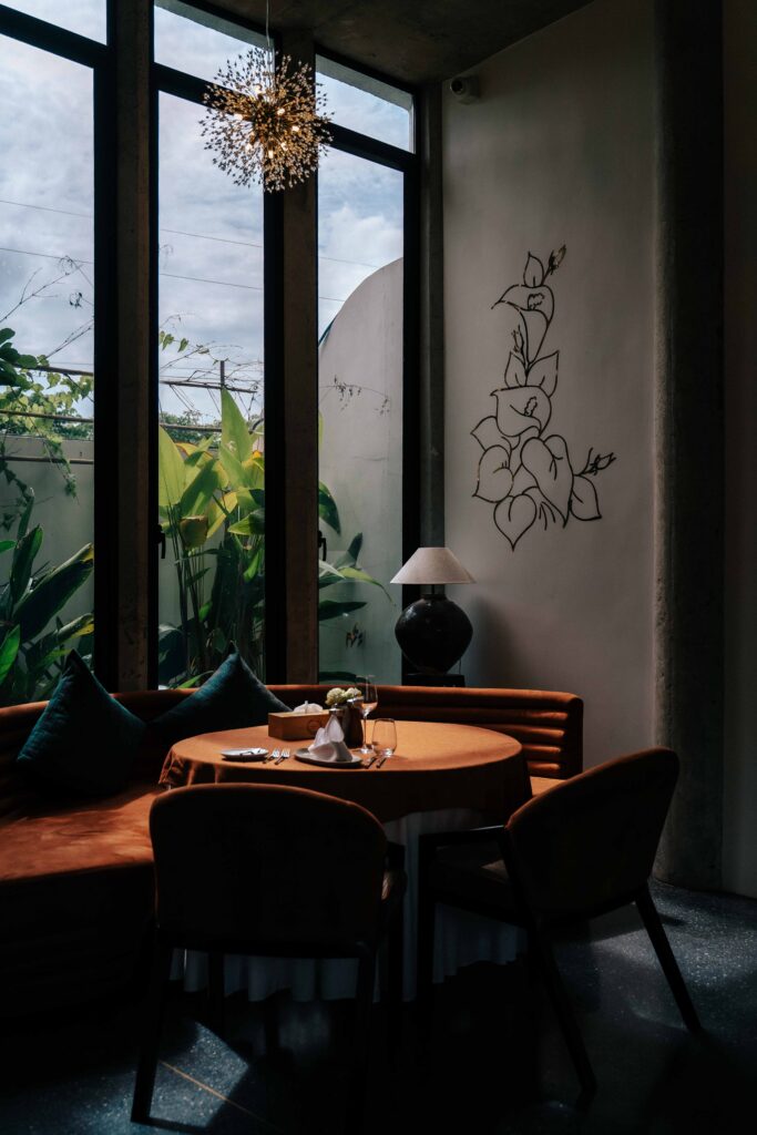 Restaurant dining area with a table illuminated by warm sunlight